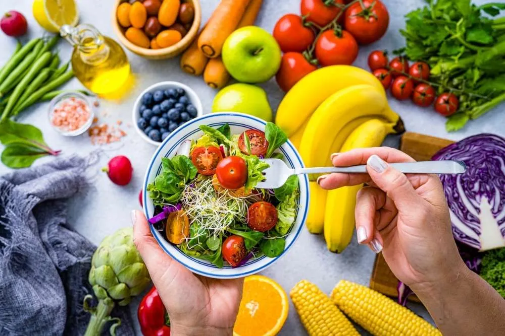 Colorful grain bowl with greens and roasted vegetables
